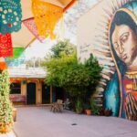 huge mural of girl praying placita mx courtyard