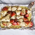 grilled potatoes on a piece of foil