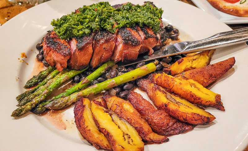 A plate of food with meat and vegetables