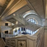 Intricate marble staircase and detailed mosaic accents inside the historic Chicago Cultural Center.