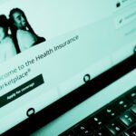 The healthcare.gov website seen on a laptop. The webpage reads, "Welcome to the Health Insurance Marketplace. Apply for coverage."