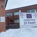 The exterior of a medical clinic with a sign reading "Celebrating 25 years"