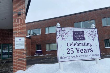 The exterior of a medical clinic with a sign reading "Celebrating 25 years"