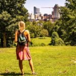 woman looking at raleigh skyline view from dix park
