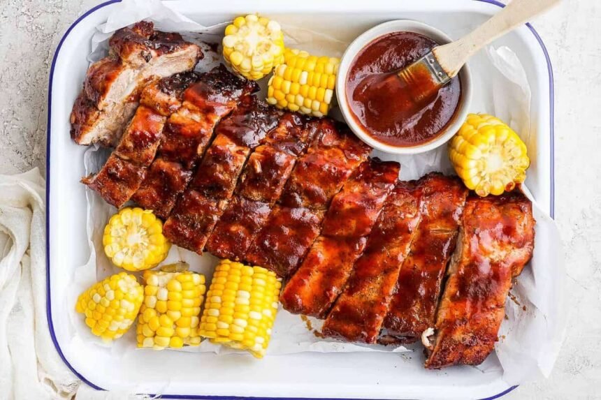 Grilled ribs and corn with bbq sauce.