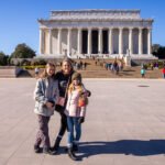 Mom and daughters looking out over the National Mall in DC