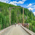 bikers on bridge on Route of the Hiawatha Trail