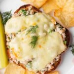 healthy tuna melt with cottage cheese served with chips and pickle